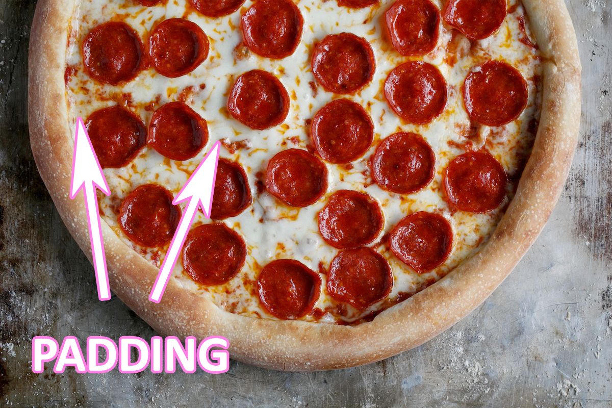 A pepperoni pizza looking delictious straight out of the oven